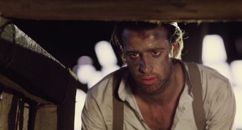 Movie still from “Highlander” (1986), directed by Russell Mulcahy – A person wearing a white shirt; Close Up shot, Low angle