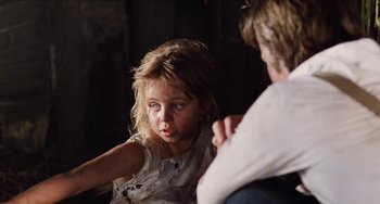Movie still from “Highlander” (1986), directed by Russell Mulcahy – A little girl sitting next to a man in a dark room; Close Up shot, Over the shoulder angle