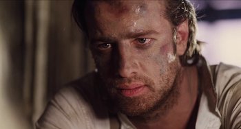 Movie still from “Highlander” (1986), directed by Russell Mulcahy – A person wearing a white shirt; Close Up shot, Low angle