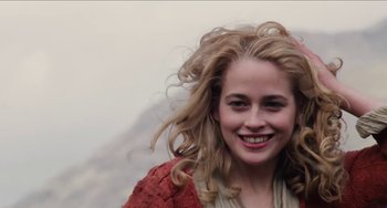 Movie still from “Highlander” (1986), directed by Russell Mulcahy – A person with long blonde hair; Close Up shot, Low angle