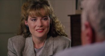 Movie still from “Highlander” (1986), directed by Russell Mulcahy – A person wearing a jacket; Close Up shot, Over the shoulder angle