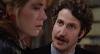 Movie still from “Highlander” (1986), directed by Russell Mulcahy – A man and a woman looking at one another; Close Up shot, Over the shoulder angle