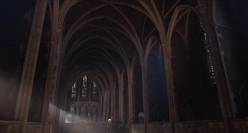 Movie still from “Highlander” (1986), directed by Russell Mulcahy – A large cathedral with a vaulted ceiling and arches; Extreme Wide shot, Low angle