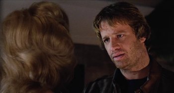 Movie still from “Highlander” (1986), directed by Russell Mulcahy – A person talking to another person; Close Up shot, Over the shoulder angle