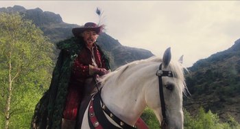 Movie still from “Highlander” (1986), directed by Russell Mulcahy – A man dressed as a pirate riding a horse; Medium shot, Low angle