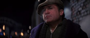 Movie still from “Hoffa” (1992), directed by Danny DeVito – A person wearing a hat; Close Up shot, Low angle