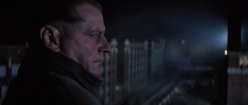 Movie still from “Hoffa” (1992), directed by Danny DeVito – A person looking out of a window at night; Close Up shot, Low angle