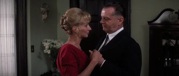 Movie still from “Hoffa” (1992), directed by Danny DeVito – An older man and a younger woman in formal wear; Close Up shot, Low angle