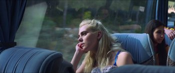 Movie still from “Holiday” (2018), directed by Isabella Eklöf – A woman sitting in a car with her head resting on her hand; Close Up shot, Over the shoulder angle