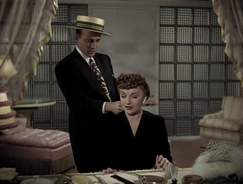 Movie still from “Holiday Inn” (1942), directed by Robert Allen – A man and a woman in a suit and tie; Medium shot, High angle