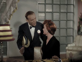 Movie still from “Holiday Inn” (1942), directed by Robert Allen – A man and a woman are talking to each other; Medium shot, High angle