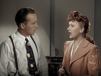 Movie still from “Holiday Inn” (1942), directed by Robert Allen – A man and a woman talking to each other; Medium shot, High angle