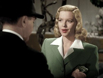 Movie still from “Holiday Inn” (1942), directed by Robert Allen – A man and a woman talking to each other in a room; Medium shot, Over the shoulder angle