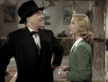 Movie still from “Holiday Inn” (1942), directed by Robert Allen – A man and a woman are talking to each other; Medium shot, Low angle