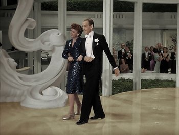Movie still from “Holiday Inn” (1942), directed by Robert Allen – A man and a woman are dancing in formal wear; Wide shot, High angle