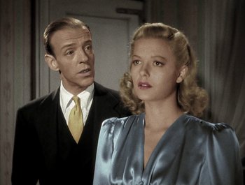 Movie still from “Holiday Inn” (1942), directed by Robert Allen – A man and a woman standing next to each other; Close Up shot, Low angle