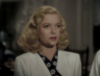 Movie still from “Holiday Inn” (1942), directed by Robert Allen – A woman with blonde hair wearing a white jacket; Close Up shot, High angle