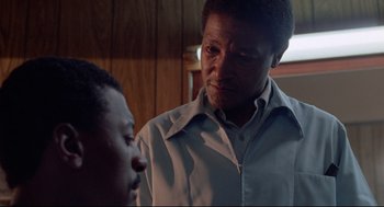 Movie still from “Hollywood Shuffle” (1987), directed by Robert Townsend – An older black man talking to a younger black man; Close Up shot, Over the shoulder angle