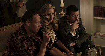Movie still from “Hollywoodland” (2006), directed by Allen Coulter – A group of people sitting next to each other in a room; Medium shot, High angle