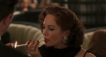 Movie still from “Hollywoodland” (2006), directed by Allen Coulter – A beautiful woman holding a toothbrush in her mouth; Close Up shot, Over the shoulder angle
