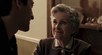 Movie still from “Hollywoodland” (2006), directed by Allen Coulter – An older woman sitting in front of a younger man; Close Up shot, Over the shoulder angle
