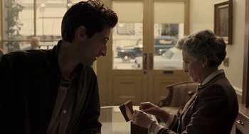 Movie still from “Hollywoodland” (2006), directed by Allen Coulter – A man and a woman sitting in front of a table; Medium shot, Over the shoulder angle