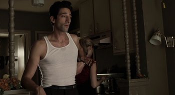 Movie still from “Hollywoodland” (2006), directed by Allen Coulter – A man and a woman standing in a kitchen next to each other; Medium shot, Low angle