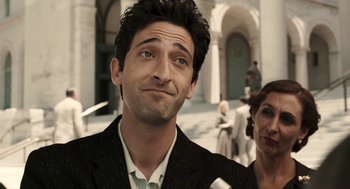 Movie still from “Hollywoodland” (2006), directed by Allen Coulter – A person wearing a suit and tie; Close Up shot, Over the shoulder angle