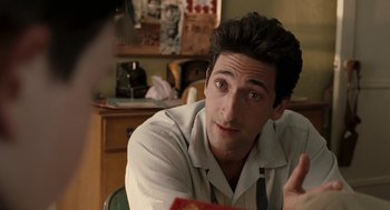 Movie still from “Hollywoodland” (2006), directed by Allen Coulter – A person sitting at a table; Close Up shot, Over the shoulder angle