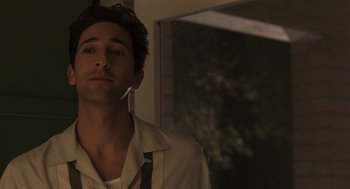 Movie still from “Hollywoodland” (2006), directed by Allen Coulter – A person wearing a shirt and tie; Close Up shot, Low angle