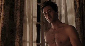 Movie still from “Hollywoodland” (2006), directed by Allen Coulter – A shirtless man standing in front of a window; Medium shot, Over the shoulder angle