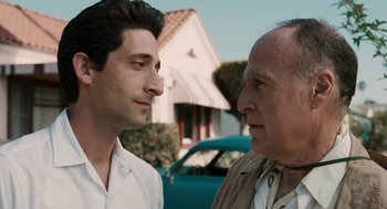 Movie still from “Hollywoodland” (2006), directed by Allen Coulter – Two men standing next to each other in front of a house; Close Up shot, Over the shoulder angle