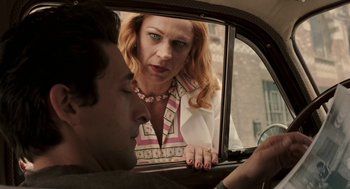 Movie still from “Hollywoodland” (2006), directed by Allen Coulter – A woman looking out of a car window at a man; Medium shot, Over the shoulder angle
