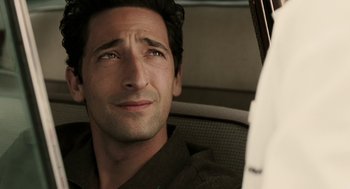 Movie still from “Hollywoodland” (2006), directed by Allen Coulter – A person sitting in a car; Close Up shot, Over the shoulder angle