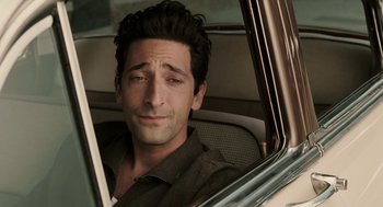 Movie still from “Hollywoodland” (2006), directed by Allen Coulter – A person sitting in a car; Close Up shot, High angle