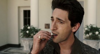 Movie still from “Hollywoodland” (2006), directed by Allen Coulter – A person brushing his teeth; Close Up shot, High angle