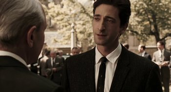 Movie still from “Hollywoodland” (2006), directed by Allen Coulter – A man in a suit and tie talking to another man in a suit and tie; Close Up shot, Over the shoulder angle