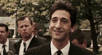 Movie still from “Hollywoodland” (2006), directed by Allen Coulter – A man in a suit and a tie; Close Up shot, Over the shoulder angle