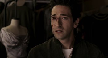Movie still from “Hollywoodland” (2006), directed by Allen Coulter – A person wearing a jacket; Close Up shot, High angle
