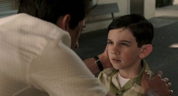 Movie still from “Hollywoodland” (2006), directed by Allen Coulter – A young boy is being examined by an older man; Close Up shot, Over the shoulder angle