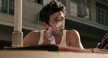 Movie still from “Hollywoodland” (2006), directed by Allen Coulter – A person smoking a cigarette; Close Up shot, High angle
