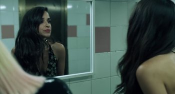 Movie still from “Holy Camp!” (2017), directed by Javier Ambrossi – A woman looking in the mirror in a bathroom; Close Up shot, Over the shoulder angle
