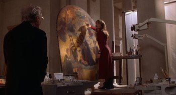 Movie still from “Home for the Holidays” (1995), directed by Jodie Foster – A woman painting a painting on a large canvas; Medium shot, Over the shoulder angle