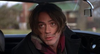 Movie still from “Home for the Holidays” (1995), directed by Jodie Foster – A person wearing a scarf; Close Up shot, Over the shoulder angle