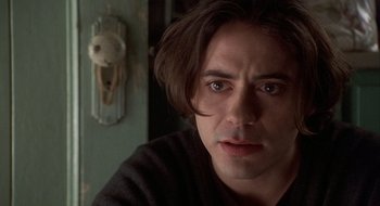 Movie still from “Home for the Holidays” (1995), directed by Jodie Foster – A person with long brown hair; Close Up shot, Over the shoulder angle