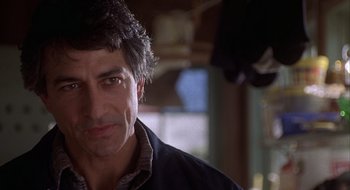 Movie still from “Home for the Holidays” (1995), directed by Jodie Foster – A person wearing a jacket; Close Up shot, Over the shoulder angle