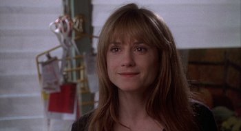 Movie still from “Home for the Holidays” (1995), directed by Jodie Foster – A person with long brown hair; Close Up shot, Over the shoulder angle