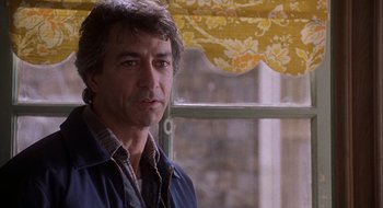 Movie still from “Home for the Holidays” (1995), directed by Jodie Foster – A person standing near a window; Close Up shot, Over the shoulder angle