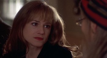 Movie still from “Home for the Holidays” (1995), directed by Jodie Foster – A person with long hair; Close Up shot, Over the shoulder angle