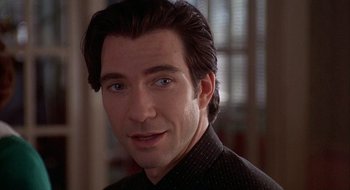 Movie still from “Home for the Holidays” (1995), directed by Jodie Foster – A person wearing a black shirt; Close Up shot, Over the shoulder angle